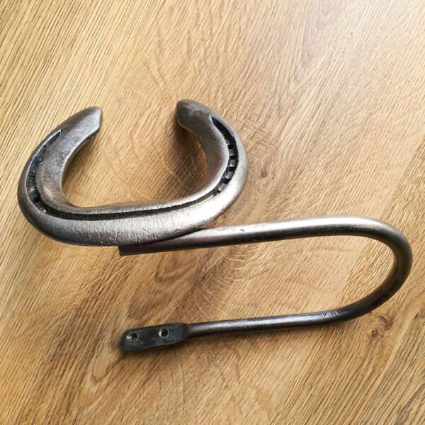 curtainarms Created from a pair of used horseshoes that have been heated and cleaned by hand to retain marks of wear and character then polished. The holdbacks are then treated in a clear sealant to protect from rust. The horseshoes are mounted on round steel for the ‘arms’ that have two screw holes for wall mounting. (Screws not supplied) The shoe size will be approximately 15cm by 15cm but this may vary slightly according to the nature of the horseshoes used.