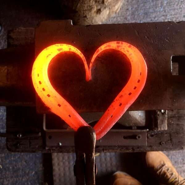 hotheart Our Original Horseshoe Heart. Skilfully hand forged from one whole used horseshoe. Crafted with care to retain wear marks and character of it's old form combined with simple, clean lines of the new. Hand stamped personalisation is available on the arches of the heart, for names, dates or phrase to make your heart extra special and unique to you. Please use the top personalistion box for the Left Arch of Heart and use the bottom personalisation box for the Right Arch of Heart
