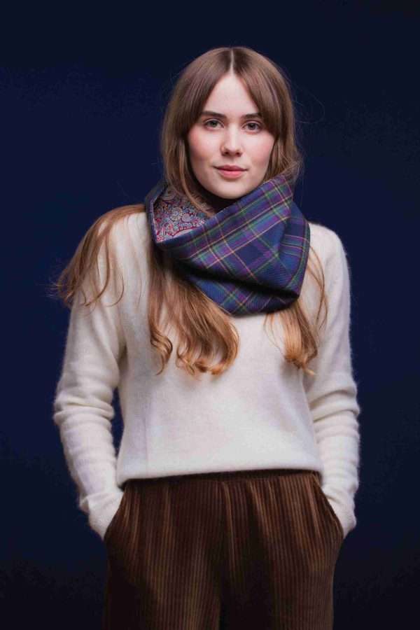 LoullyMakes Studio 4 54 scaled Classic Cowl in our exclusive Highland Mist Tartan with Liberty Print tana lawn cotton lining. Simply select your choice of coloured lining from the drop-down menu. (The example cowl pictured here features lining 7) This easy-to-wear cowl combines effortless styling and sublime warmth, being formed from a simple superfine cotton lined "tube" of 100% wool Highland Mist Tartan. Simply pop over your head and wear the cowl high, to keep out the chill, or roll over the neckline to feature a flourish of an iconic art fabric. 100% Wool Tartan, 100% cotton lining