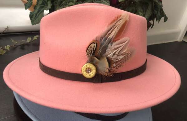 WhatsApp Image 2021 01 29 at 09.12.39 1 Baby Pink wool felt fedora hat with feather pin. My wool felt fedora hats are beautifully made, water resistant & come complete with a detachable natural game feather pin. Available in sizes; Extra small 53-54cm,  Small 55-56cm & Medium 57-59cm The fedora hat is made from 100% wool felt and suitable to be worn in all weathers.  If the hat does get wet just leave it to dry flat & naturally.