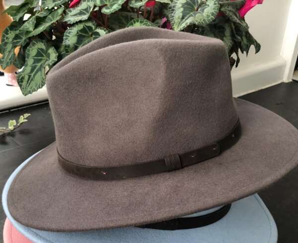 WhatsApp Image 2021 01 29 at 09.12.41 Warm Grey wool felt fedora hat with feather pin. My wool felt fedora hats are beautifully made, water resistant & come complete with a detachable natural game feather pin. Available in sizes; Extra small 53-54cm,  Small 55-56cm & Medium 57-59cm The fedora hat is made from 100% wool felt and suitable to be worn in all weathers.  If the hat does get wet just leave it to dry flat & naturally.
