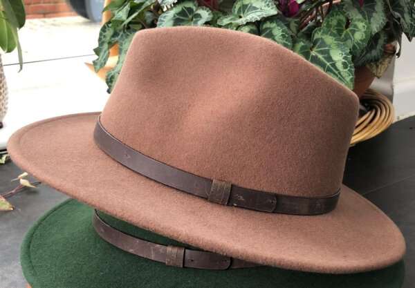 WhatsApp Image 2021 01 29 at 09.12.44 1 Light Brown wool felt fedora hat with feather pin. My wool felt fedora hats are beautifully made, water resistant & come complete with a detachable natural game feather pin. Available in sizes; Extra small 53-54cm,  Small 55-56cm & Medium 57-59cm The fedora hat is made from 100% wool felt and suitable to be worn in all weathers.  If the hat does get wet just leave it to dry flat & naturally.