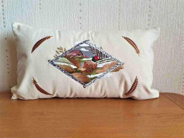 20210131 142951 scaled Very detailed embroidered Pheasant & Country Scene Cushion Cover available on Natural or Black Canvas. As you can see from the images the embroidery is of the best quality and has over 80,000 stitches in it. This design can be embroidered onto other items such as Hoodies, canvas bags, jackets and throws etc Natural canvas cushion cover. The rectangular shape creates interest in the lounge and bedroom and is a neat addition to home furnishings where the natural fabric sits happily with different textures and colour. <strong>The Cushion cover is 20"x 11"</strong> As all products are made to order please allow 7 working days for delivery. If you require anything urgently please ask as we may be able reduce our production times.