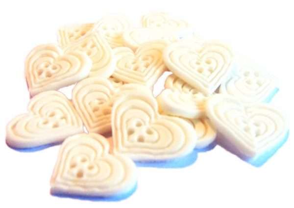 18 white heart buttonsJpeg If you’re looking for colourful edible heart shaped buttons to decorate your cupcakes and cakes then these are ideal for all your special occasions. Offering a choice of many single and mixed colours that are sure to please. Note: we also have square shaped buttons in same colours for those who would like to have a mix of each. 18 Heart Shaped Buttons Approx Size: 20mm high - 20mm wide