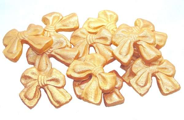 Inked12 Small Gold bows LI These small coloured Glittered edible bows decorations will enhance any cupcake or cake. Available in a choice of colours making them ideal for Weddings, Birthdays, Valentine & Anniversary decorations Approx Size: 24mm high - 28mm wide