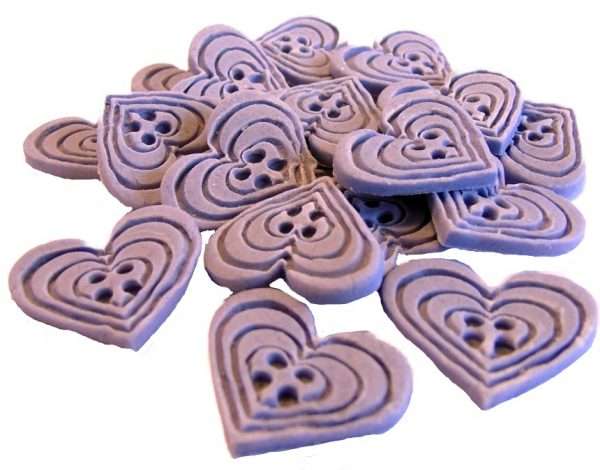 Inked18 purple heart buttons1jpeg LI If you’re looking for colourful edible heart shaped buttons to decorate your cupcakes and cakes then these are ideal for all your special occasions. Offering a choice of many single and mixed colours that are sure to please. Note: we also have square shaped buttons in same colours for those who would like to have a mix of each. 18 Heart Shaped Buttons Approx Size: 20mm high - 20mm wide