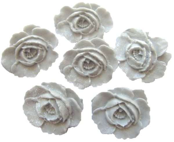 Inked6 Large N Silver Rosesjpeg LI We have here edible roses that you can use to decorate your cakes and cupcakes with. All are edible and glittered to add that extra sparkle. We have a large selection of colours for you to choose from that will be sure to please all your guests. These are ideal for any occasion and celebration bakes. Approx Size: 4 cm wide