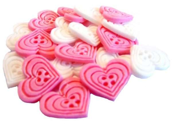 InkedInked18 Pink White heart buttons1 LI If you’re looking for colourful edible heart shaped buttons to decorate your cupcakes and cakes then these are ideal for all your special occasions. Offering a choice of many single and mixed colours that are sure to please. Note: we also have square shaped buttons in same colours for those who would like to have a mix of each. 18 Heart Shaped Buttons Approx Size: 20mm high - 20mm wide