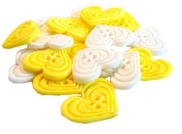 InkedInked18 Yellow white heart buttons LI If you’re looking for colourful edible heart shaped buttons to decorate your cupcakes and cakes then these are ideal for all your special occasions. Offering a choice of many single and mixed colours that are sure to please. Note: we also have square shaped buttons in same colours for those who would like to have a mix of each. 18 Heart Shaped Buttons Approx Size: 20mm high - 20mm wide