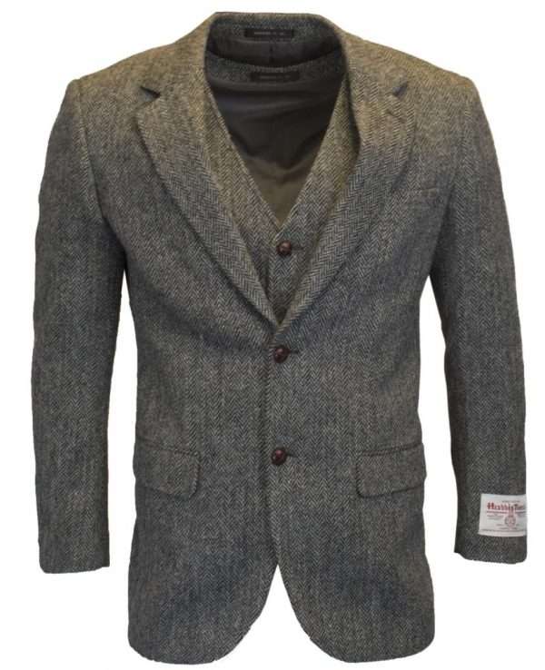 steel grey blazer wc 1 These world famous Harris Tweed jackets, are superbly tailored, hard wearing and warm. When purchasing one of these jackets you are guaranteed exceptional quality. By law Harris Tweed must come from the Outer Hebrides, and be hand woven from local wool. Supplied by Harris Tweed Scotland from 100% pure virgin wool, dyed, spun and finished in the Western Isles of Scotland. Hand-woven by crofters in their own homes on the islands of Lewis, Harris, Uist and Barra. They are single breasted with two leather button fastening, and can be worn as a casual jacket or with a shirt and tie. Other specifications include side vents, two front pockets with flaps, Four interior pockets, three button leather cuff and Fully lined. Spare Button Leather buttons included. Dress with matching waistcoat for an extremely stylish look perfect for weddings and the races. All our tweeds are stamped with the authentic, official gold crossed orb mark of the Harris Tweed Authority.