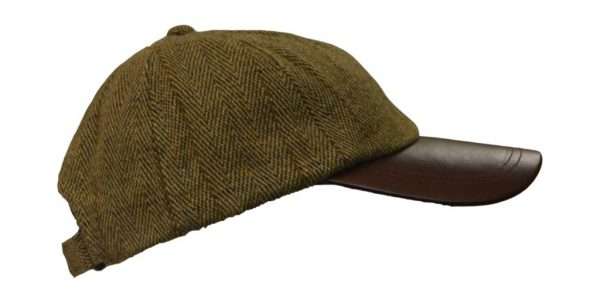 tweed leather peak baseball cap Inner Linning is 100% Polyester satin lining, with an inner trim band for extra comfort. Outer jacket (shell) is made from 60% wool, 25% polyester, 11% acrylic and 4% composed of other fibres, making this cap of top quality fabric. Adjustable Velcro fitting with matching tweed lined band. Produced to the highest standards by a manufacturer of top quality countrywear and derby clothing. The tweed has been treated with teflon, which acts as a fabric protector, making this product long lasting-lasting protection against oil- and water-based stains, dust and dry soil.