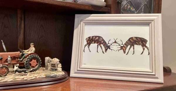 282B48AB DE57 4E36 87D8 512C2F8F2B3D scaled Stunning Rutting Stags silhouette crafted with hand picked pheasant feathers. The Picture comes framed Due to the nature of the feathers no two pictures are the same and may differ slightly from the picture. All the feathers are 100% locally sourced and the picture hand crafted on our farm in Devon. This gorgeous picture is sure to look great in any home or shooting lodge and bring the elegance of the British countryside inside. This picture is perfect as a gift for anyone with a country/shooting or hunting theme and can easily be personalised with names or dates added. Would make great Father’s Day present or birthday present. Other designs are available
