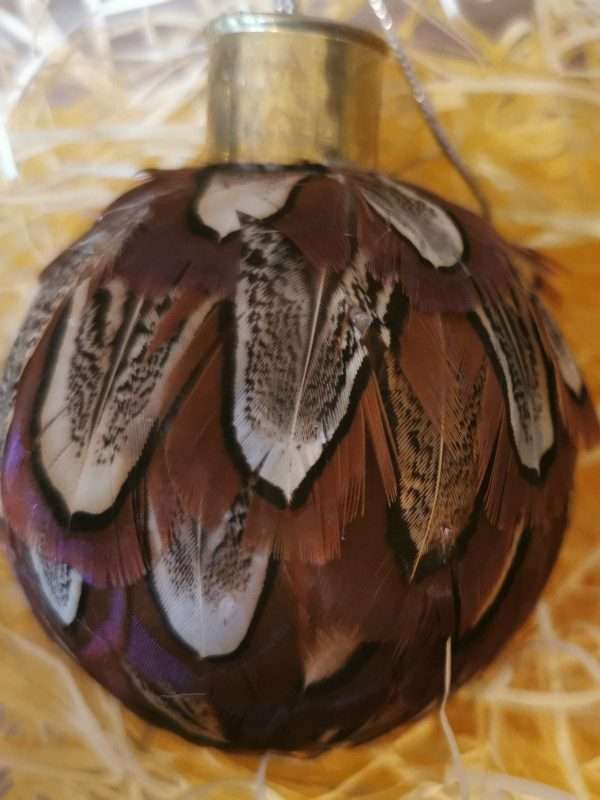 Beautiful carefully handcrafted baubles . Made using only the finest Ringneck Hen Pheasant Feathers to create something stunning. Available as either Cock or Hen.