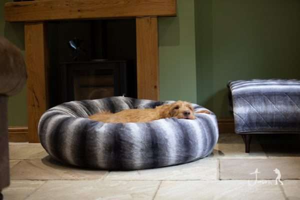 Collared Creatures Grey Luxury Deluxe Donut Dog Bed with Evie lied down