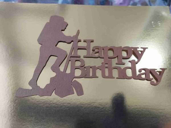walker scaled A card cake topper for the hiker/walker/rambler. 5.5" x 4" in bronze matt card with food safe wooden supports. Can be personalised with name of recipient