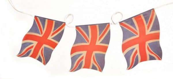 D754 Faded Union Jack Small bunting A pack of ten paper Union Jack wavy handwaving flags with plastic flagpoles. Perfect for celebrating British events such as the Queen's Platinum Jubilee, VE Day, village fetes and street parties. This product is made in the U.K.