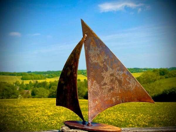 WELCOME TO THE RUSTIC GARDEN ART SHOP Here we have one of our. Small Rustic Rusty Metal Sail Sailing Boat Art Gift Sculpture Sizes & Measurements: 25cm x 25cm Made From 2mm Mild Steel.