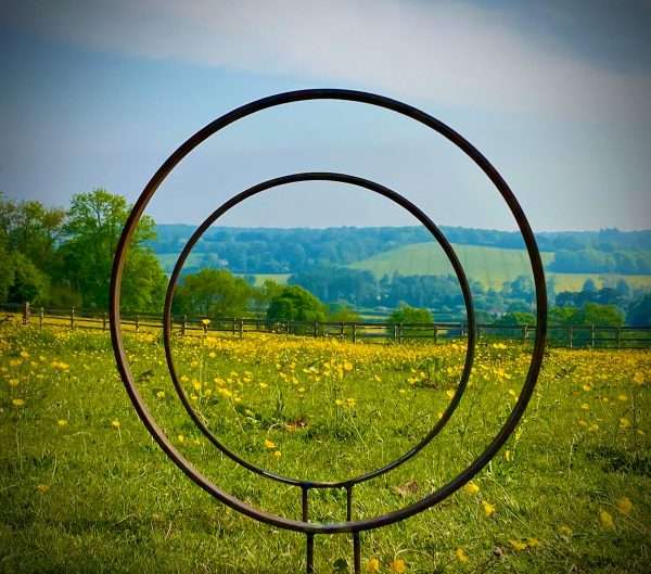 WELCOME TO THE RUSTIC GARDEN ART SHOP Here we have one of our. Rustic Metal Garden Ring Hoop Sculpture - Pair of Rusty Ring Circle Garden Art / Globe / Sphere Interchangeable metal ring sculptures - one is slightly smaller so fits within the other ring with two stakes per ring. Enabling you to arrange your own formation or design. These two rustic garden rings make a unique, versatile garden sculpture. Arrange the rusty metal rings in any formation to create your very own unique piece of affordable garden decor. Our Rustic/Rusty patina gives a natural and unique finish, which will continue to better with age. Our rustic garden art products require absolutely no maintenance! Sizes & Measurements:
Small - Approx 30cm diameter -made from flat steel 30mm x 8mm