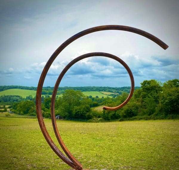WELCOME TO THE RUSTIC GARDEN ART SHOP Here we have one of our. Rustic Metal Garden Art Abstract Flowing Swirl Metal Ring Sculpture Scroll Sphere Arched Yard Art Gift Arched metal 3/4 ring sculptures - one is slightly smaller so fits within the other ring with a base plate & ground stake These two rustic garden arches make a unique, versatile garden sculpture. Our Rustic/Rusty patina gives a natural and unique finish, which will continue to better with age. Our rustic garden art products require absolutely no maintenance! Sizes & Measurements:
Small: approx 25cm x 30cm x 7cm