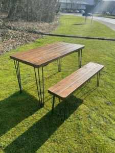 download 18 Solid Wood Rustic Outdoor Garden Patio Dining / Restaurant / Bistro / Cafe / Bar Table Extra Chunky Reclaimed timber style 67cm wide x a range of lengths up to 140cm Solid wood tabletop and hairpin legs Matching Benches available Please check our or shop If you cant see the size you are after please message us as we are more than happy to create custom sizes for you. **FREE DELIVERY** Please Note: The tabletops are sent out by a secure service via DX Express and the Legs should arrive the same day via DPD Black Powder Coated steel hairpin legs Handmade from environmentally reclaimed pine timber and finished buy hand in our workshops in the heart of the New Forest Please note that due to the rustic design and style of the piece that the wood will take the stain differently in each piece Kind Regards Ben and Esther at New Forest Countryside *****PLEASE NOTE DUE TO TIMBER SHORTAGES IN THE UK SOME DELIVERIES MAY BE SLIGHTLY DELAYED, WE WILL ENDEAVOR TO KEEP THIS TO A MINIMUM WHILST PROVIDING THE SAME GREAT VALUE TO OUR CUSTOMERS. MANY THANKS THE NFC TEAM******