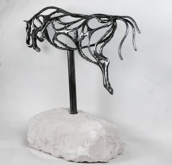 ABSTRACT JUMPING HORSE SCULPTURE Gallery 2 Elliott of London Abstract Jumping Horse Limited Edition 1 of 1 One-Off Sculpture Handcrafted Abstract Jumping Horse Sculpture by British Sculptor Charles Elliott   This piece is suitable for a table feature or interior ornament. In a rugged texture mild Steel with a interior gloss finish.   Handmade in Buckinghamshire. Overall Dimensions: 54cm Long 52cm Height 22cm Width   Limited Edition - 1 of 1- One- Off Sculpture   Worldwide Shipping Available! All Commissions Welcome www.elliottoflondon.co.uk info@elliottoflondon.co.uk