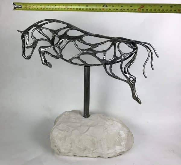 ABSTRACT JUMPING HORSE SCULPTURE Gallery 7 Elliott of London Abstract Jumping Horse Limited Edition 1 of 1 One-Off Sculpture Handcrafted Abstract Jumping Horse Sculpture by British Sculptor Charles Elliott   This piece is suitable for a table feature or interior ornament. In a rugged texture mild Steel with a interior gloss finish.   Handmade in Buckinghamshire. Overall Dimensions: 54cm Long 52cm Height 22cm Width   Limited Edition - 1 of 1- One- Off Sculpture   Worldwide Shipping Available! All Commissions Welcome www.elliottoflondon.co.uk info@elliottoflondon.co.uk