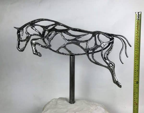 ABSTRACT JUMPING HORSE SCULPTURE Gallery 8 Elliott of London e1638360290279 Abstract Jumping Horse Limited Edition 1 of 1 One-Off Sculpture Handcrafted Abstract Jumping Horse Sculpture by British Sculptor Charles Elliott   This piece is suitable for a table feature or interior ornament. In a rugged texture mild Steel with a interior gloss finish.   Handmade in Buckinghamshire. Overall Dimensions: 54cm Long 52cm Height 22cm Width   Limited Edition - 1 of 1- One- Off Sculpture   Worldwide Shipping Available! All Commissions Welcome www.elliottoflondon.co.uk info@elliottoflondon.co.uk
