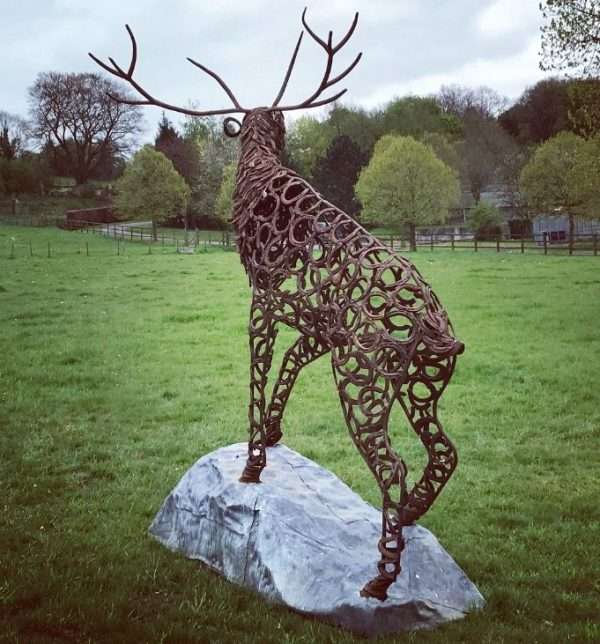 CLIMBING STAG BELLOW Gallery 1 Elliott of London Limited Edition 1 of 1 One-Off Sculpture Full Size Bespoke Stag Sculpture Handmade in Buckinghamshire by Charles Elliott from Elliott of London   A large full size stag handmade from Upcycled horse shoes, stood proud on a lead base to signify a large rock.   Can be viewed at Chiltern View Nursery - Wendover   One of a kind, all handmade and bespoke!   Worldwide Shipping Available! All Commissions Welcome www.elliottoflondon.co.uk info@elliottoflondon.co.uk