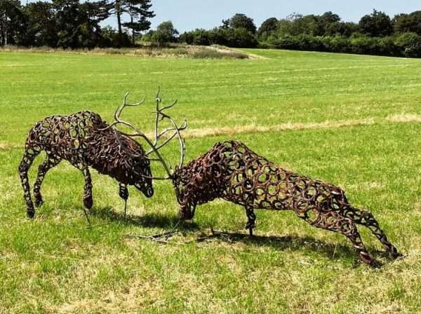 Fighting Stags Sculpture Gallery 3 SOLD Limited Edition 1 of 1 One-Off Sculpture Similar available to order - 'Fighting Stags' Full Size Handmade Bespoke Sculpture Two large full size stags fighting, handmade from Upcycled horse shoes - One of a kind, all handmade and bespoke! Designed and Made by Artist Charles Elliott   Approximate Dimensions - Length 5.2 m Width 0.75m Height 1.5 m All supports will be cut off and the sculpture is to be fitted 100mm below ground level, pictures do the sculpture no real justice! Viewing Welcome Anytime -   Delivery and Installation Services Available Worldwide Shipping Available! All Commissions Welcome www.elliottoflondon.co.uk info@elliottoflondon.co.uk
