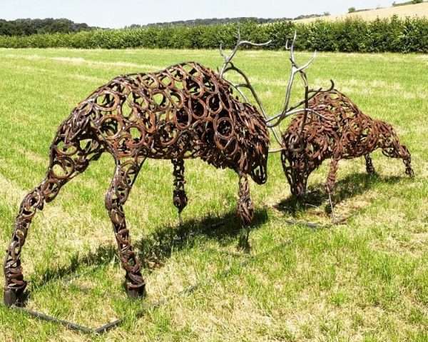 Fighting Stags Sculpture Gallery 6 SOLD Limited Edition 1 of 1 One-Off Sculpture Similar available to order - 'Fighting Stags' Full Size Handmade Bespoke Sculpture Two large full size stags fighting, handmade from Upcycled horse shoes - One of a kind, all handmade and bespoke! Designed and Made by Artist Charles Elliott   Approximate Dimensions - Length 5.2 m Width 0.75m Height 1.5 m All supports will be cut off and the sculpture is to be fitted 100mm below ground level, pictures do the sculpture no real justice! Viewing Welcome Anytime -   Delivery and Installation Services Available Worldwide Shipping Available! All Commissions Welcome www.elliottoflondon.co.uk info@elliottoflondon.co.uk