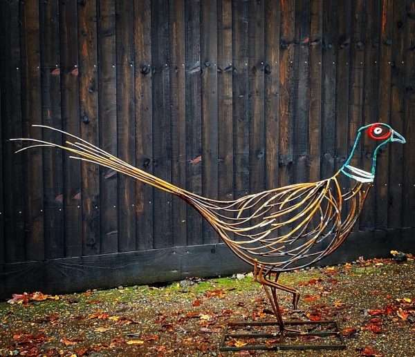 Pheasant Sculpture Main Pheasant Sculpture Handcrafted in our Berkhamsted Studio. Our Pheasant can finished in a rustic patina or be finished with painted features. Dimensions (roughly)   55cm high x 25cm wide x 90cm long ( tail included) £600.00   All Enquiries Welcome Worldwide Shipping & Installation Available   We Welcome Studio Visits - By Appointment Only www.elliottoflondon.co.uk info@elliottoflondon.co.uk 01494 758 896