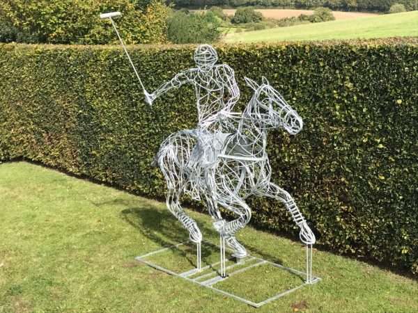 Polo Pony Sculpture Gallery 12 Limited Edition 1 of 1 One-Off Sculpture Full Size Bespoke Polo Pony and Rider Sculpture - Handmade in Buckinghamshire Handcrafted by Charles Elliott from 8mm round mild steel to indicate power and flow, luxurious progressive zinc exterior galvanised finish to protect the piece from nature and rust for over 30 years! Delivery and Installation Services Available - Worldwide Shipping and International Delivery Available! Limited Edition 1 of 1 One-Off Sculpture All Enquiries Welcome - Available to Buy, as well as long term and short term hire! Approx Dimensions: Height 2.7m Height incl stick 3.15m Length 2.6m Width 1m Studio Office - 01494758896 London Showroom - 02080503702 Charles - 07591730415 Website: www.elliottoflondon.co.uk Email: Elliott-group@outlook.com Viewing Welcome Anytime - the Vale, Buckinghamshire near London England All Sculpture Commissions Undertaken at our Buckinghamshire studio . Please call or email to enquire or to arrange an appointment.