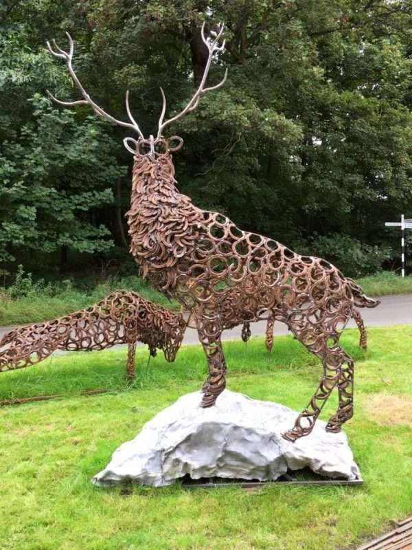 Watchful Stag Sculpture Gallery 3 Watchful Red Stag' Full Size Bespoke Stag Sculpture Handmade in Buckinghamshire by Charles Elliott from Elliott of London A large full size stag handmade from Upcycled horse shoes, stood proud on a lead base to signify a large rock. Can Be Seen At Ashridge Farm, Hertfordshire   One of a kind, all handmade and bespoke! Viewing Welcome Delivery and Installation Services Available Worldwide Shipping Available! All Commissions Welcome www.elliottoflondon.co.uk info@elliottoflondon.co.uk