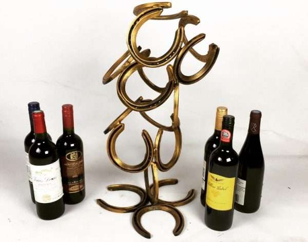 download 61 Handmade Wine Rack Made from horseshoes Holds 6 bottles of wine. Ideal as a display piece within a kitchen or dinning area.   Standard or Limited Edition Black & Gold Patina   Wine NOT included unless option is selected   Each Item is made to order. Other Finishes Available on request Worldwide Shipping Available! All Commissions Welcome www.elliottoflondon.co.uk info@elliottoflondon.co.uk