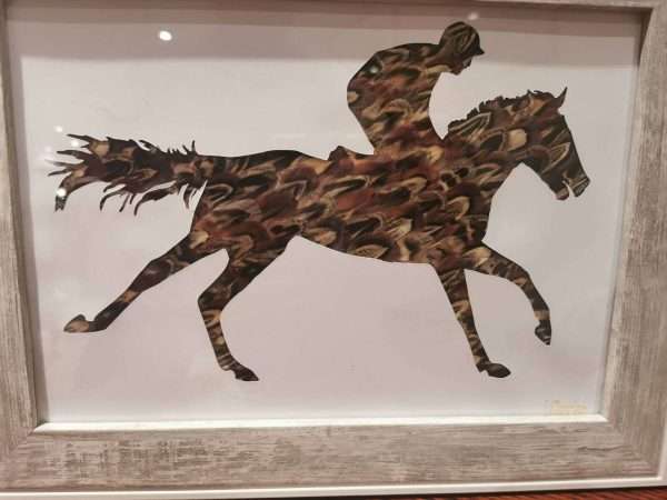 Galloping Feather Racehorse -Shooting Gift -Racing Gift - Game Bird Gift -Pheasant Feather Silhouette Present - Horse Racing. National Hunt Beautiful handmade feather silhouette crafted with hand picked pheasant feathers. Sure to look great in any home or shooting lodge or racing themed house. Picture comes framed and can be mounted if wished. Due to the nature of the feathers no two pictures are the same so may differ slightly from the listing picture. All the feathers are 100% locally sourced and the picture hand crafted on our farm in Devon. Perfect as a gift for anyone with a country/shooting or hunting theme Gift can be personalised with writing or different feathers. Other frames available - please specify in the customisation if you would like a dark, wooden or light frame Available in various sizes