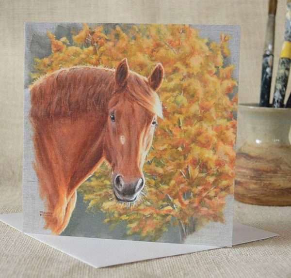 Suffolk Punch horse art head study square blank greetings or birthday card. Viewed upright on top of a white envelope with small vase containing paintbrushes in the background