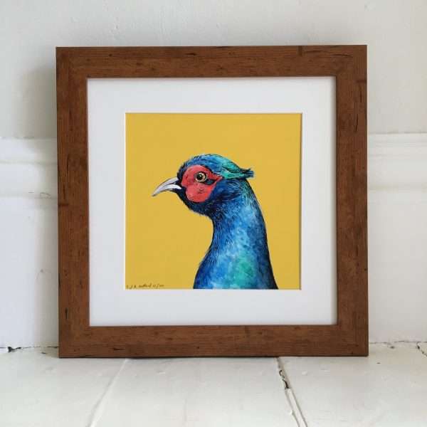 Pheasant illustration on a bright yellow background in a wooden frame.