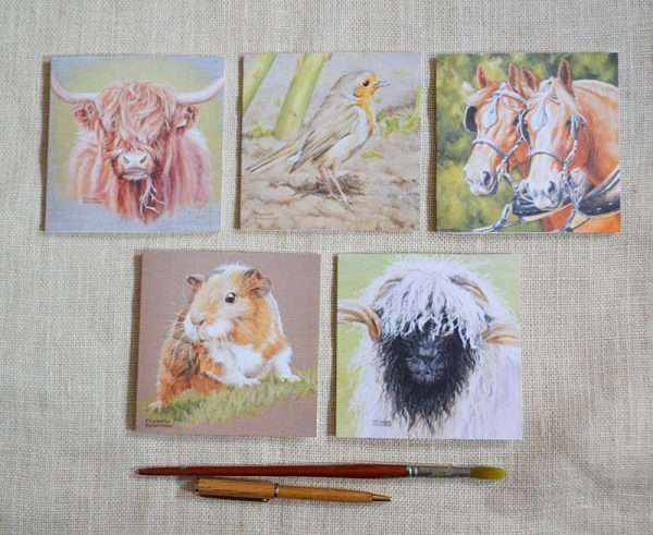 Pack of 5 blank animal art greetings cards. One each of highland cow, robin, pair of horses in harness, guinea pig and valnais sheep