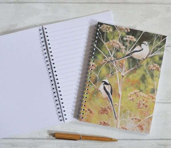A5 ring bound notebook showing birds on cover and an open version showing alternate lined and plain pages
