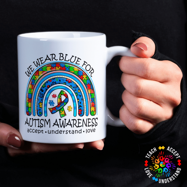We wear blue for Autism Rainbow Mug Introducing our Autism Mug, a unique and thoughtful piece that not only serves as a functional item but also as a symbol of understanding, acceptance, and love for those living with Autism. This mug is not just an ordinary beverage holder; it is a statement piece that carries a powerful message.